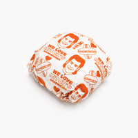 White greaseproof food paper wrapping a burger